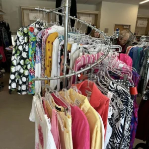 A rack of clothes for sale at Take 2 Thrift Shop