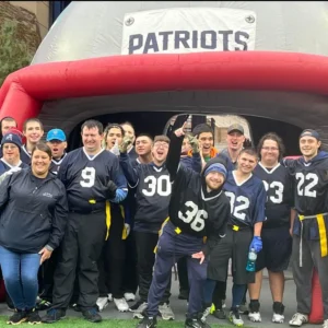 Group of flag football athletes posing at Special Olympics