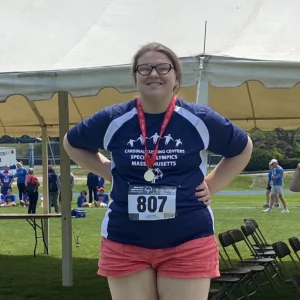 Athlete on podium at MA Special Olympics