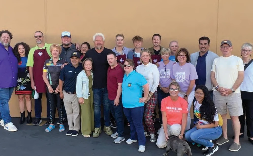Guy Fieri with contestants, families, judges and crew