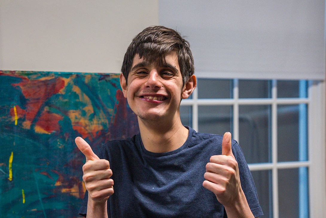 Cushing student giving double thumbs up with a big smile