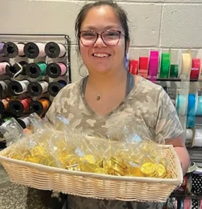 Abby Nix working at the Peppermint Twist Candy Shoppe.