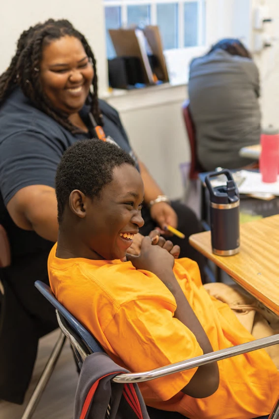 Cushing student Davis Lubrin and staff member Ebony Chandler in the new classroom space.