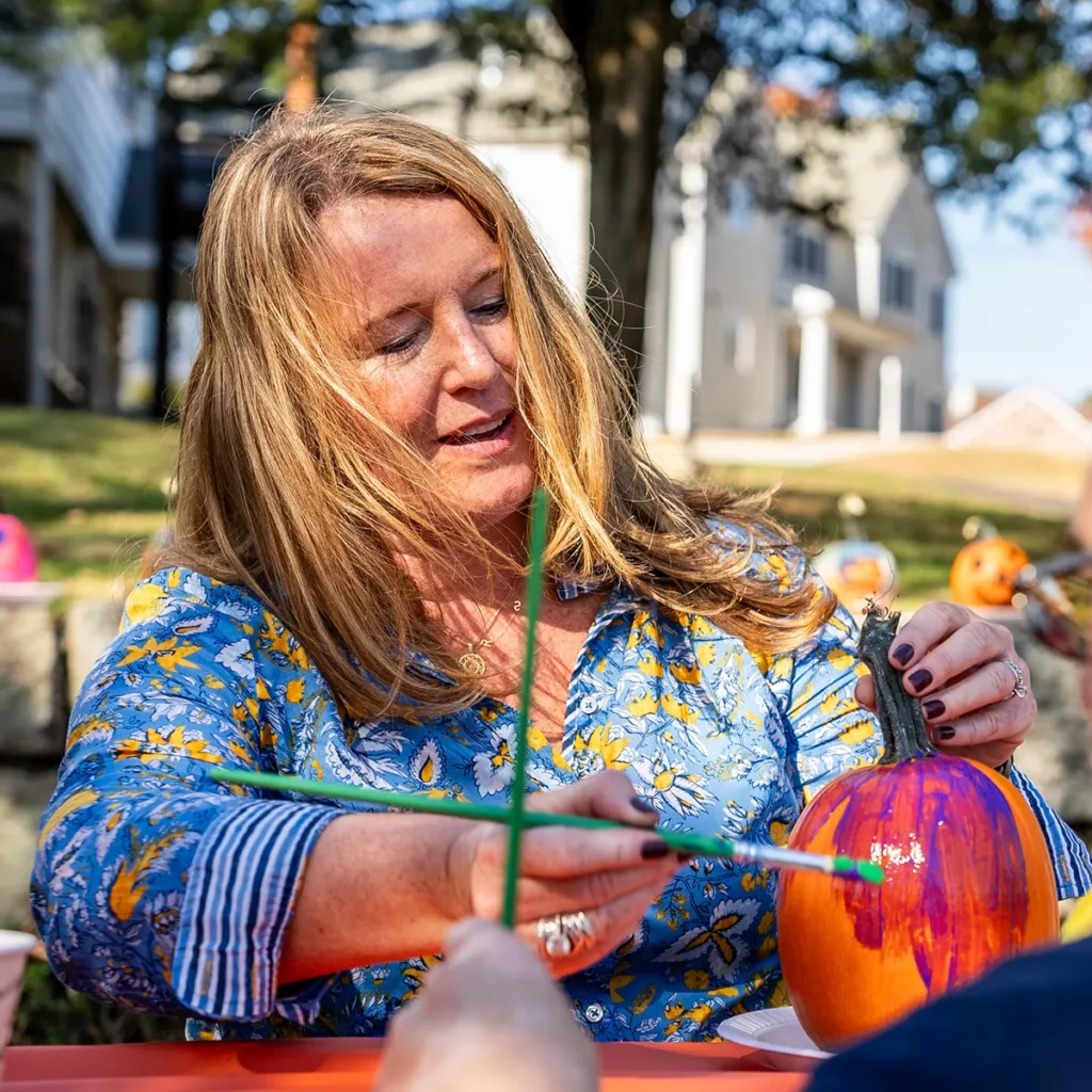 Cushing CEO Michelle Markowitz
painting a pumpkin