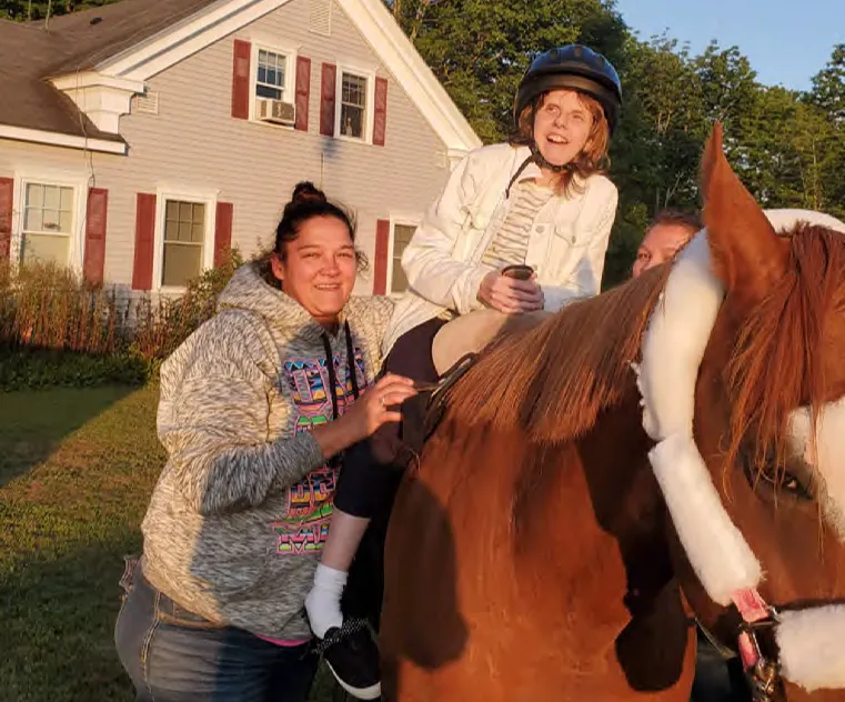 Courtney Schleicher riding a horse