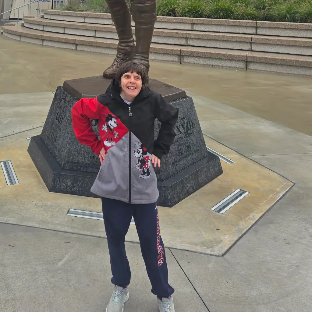Courtney Schleicher standing in front of a statue