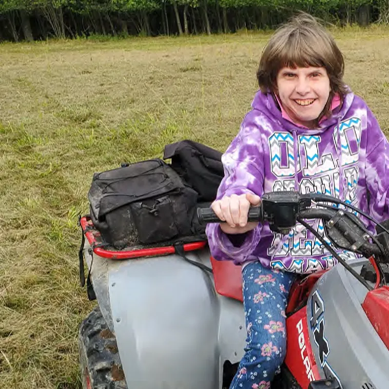 Courtney Schleicher riding an ATV