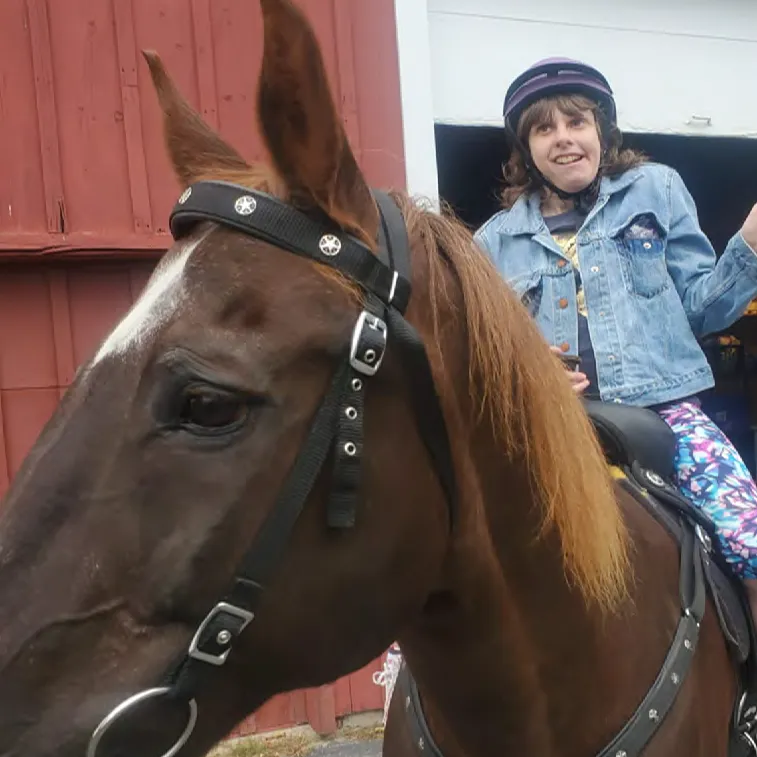 Courtney Schleicher riding a horse