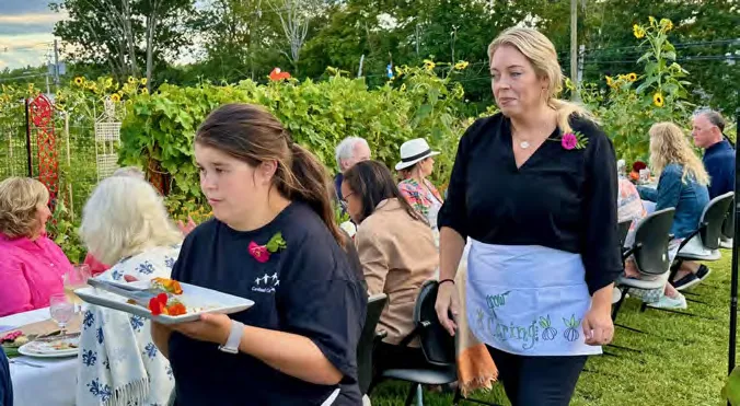 Guests enjoy a farm-to-table dinner.