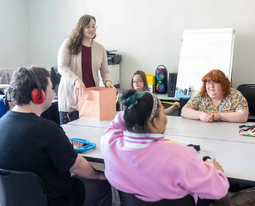 Mulitimedia arts teacher Hannah Meallo instructs her class on how to construct a collage that represents them.