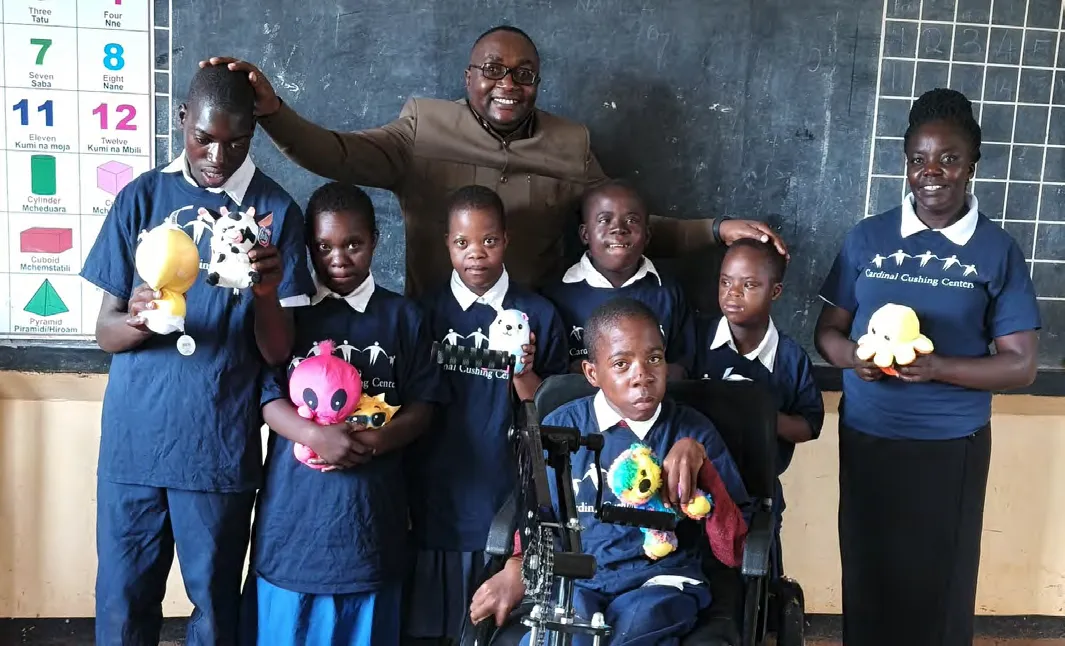 African students sport their Cushing t-shirts.