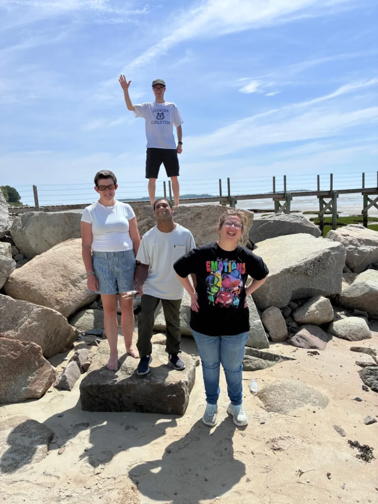 Four Cushing adults together by the water in Duxbury