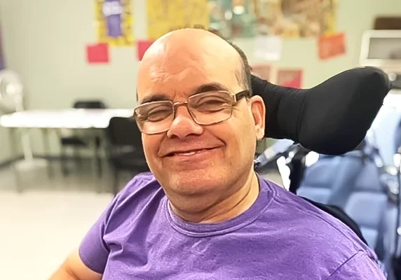 Adult in wheelchair smiling